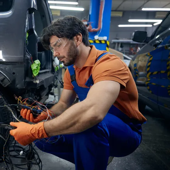An auto technician working on a vehicle