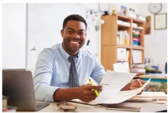 A professional with papers, ready for a conversation